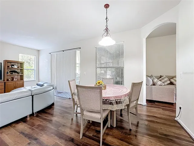 a kitchen with stainless steel appliances granite countertop a sink a stove and cabinets
