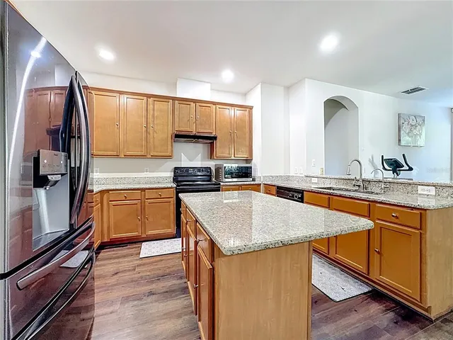 a living room with fireplace furniture and a flat screen tv