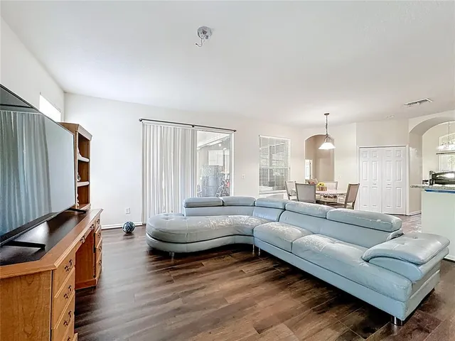 a bathroom with a granite countertop sink a bathtub and a large mirror