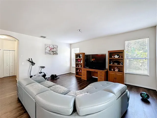 a bathroom with a shower and a glass door