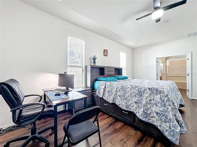 a bedroom with a bed and a dresser