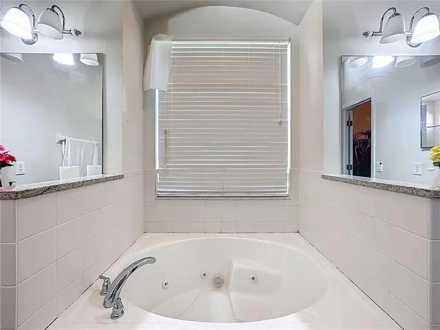 a backyard of a house with a yard and outdoor seating