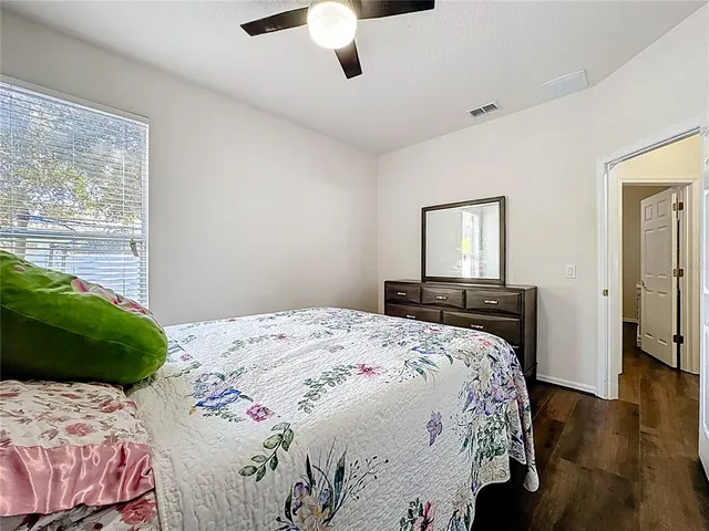 an aerial view of a house with a yard and lake view