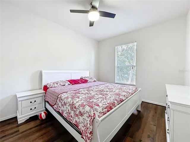 an aerial view of a house with yard