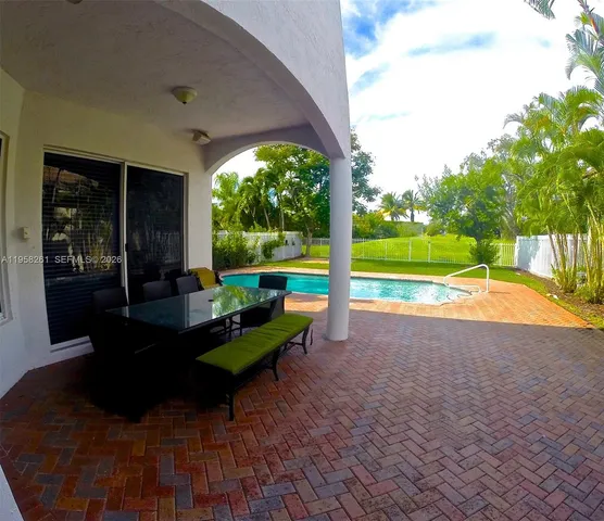 a house view with a sitting space and garden space
