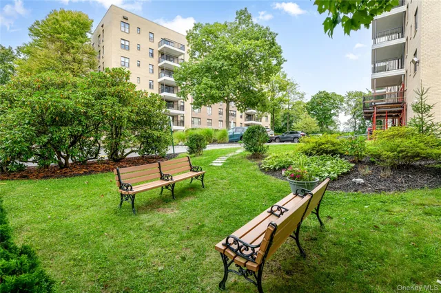 a view of a backyard with wooden fence