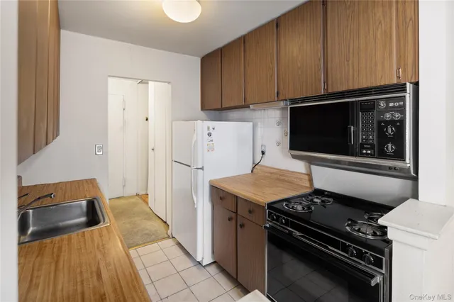 a kitchen with a stove and a microwave