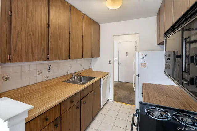 a kitchen with a stove and a refrigerator