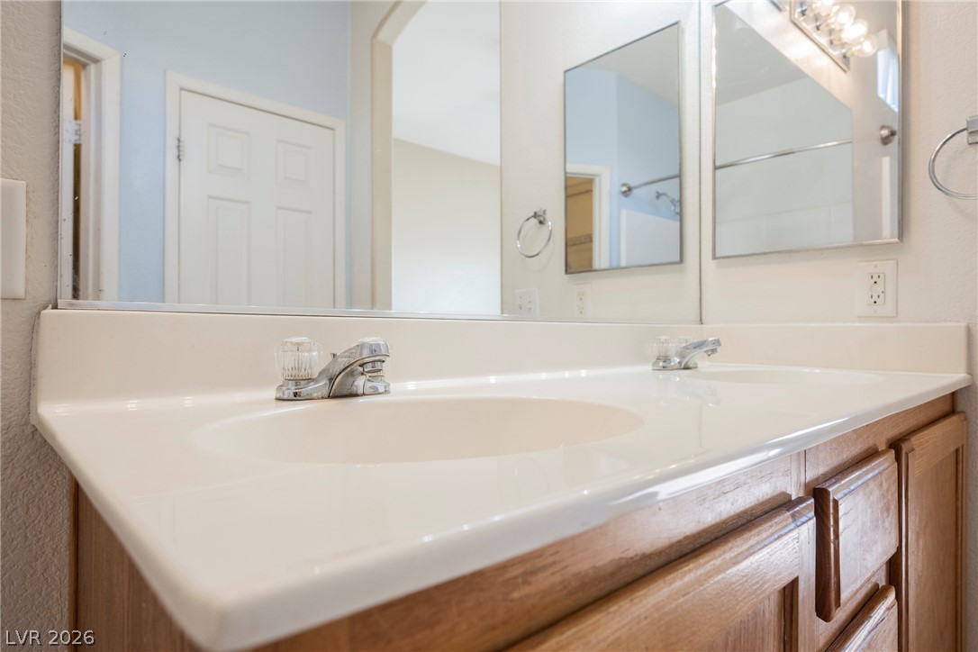 6320 Snap Ridge Street, Unit 201 North Las Vegas, NV 89081 - Photo 30 of 56 Double vanity with ample counter space and framed mirrors offers morning convenience.