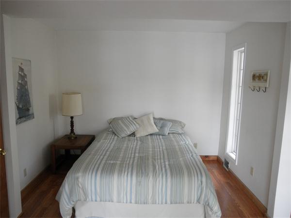 26 Old Acres Road Holland, MA 01521 - Photo 9 of 15 a bedroom with a bed and a wooden floor