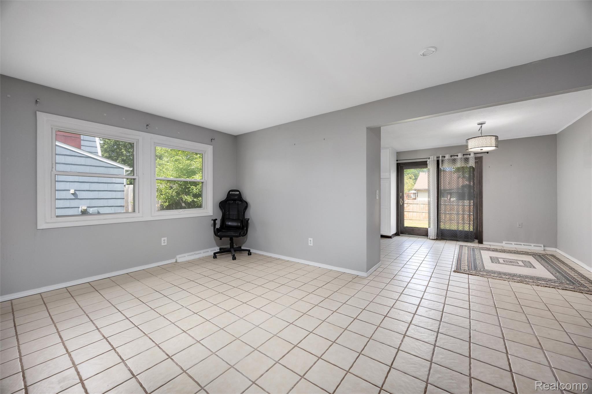 4942 Butler Drive Troy, MI 48085 - Photo 5 of 33 Spacious room featuring light-toned square tile flooring throughout
