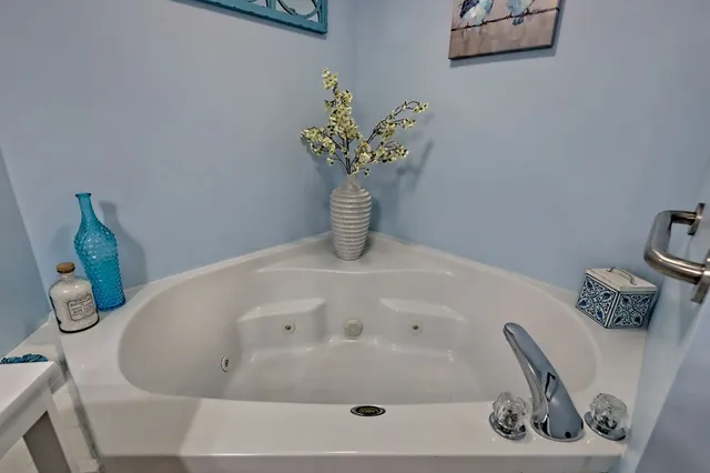 a kitchen with furniture a refrigerator and a sink