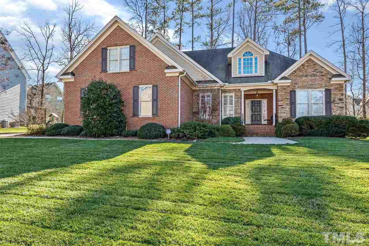 7913 Pine Timber Drive Raleigh, NC 27613 - Photo 1 of 25 a front view of a house with a yard