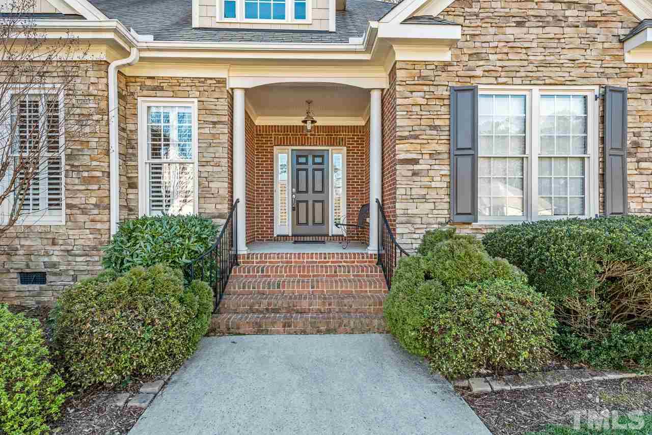 7913 Pine Timber Drive Raleigh, NC 27613 - Photo 2 of 25 front view of a brick house with potted plants