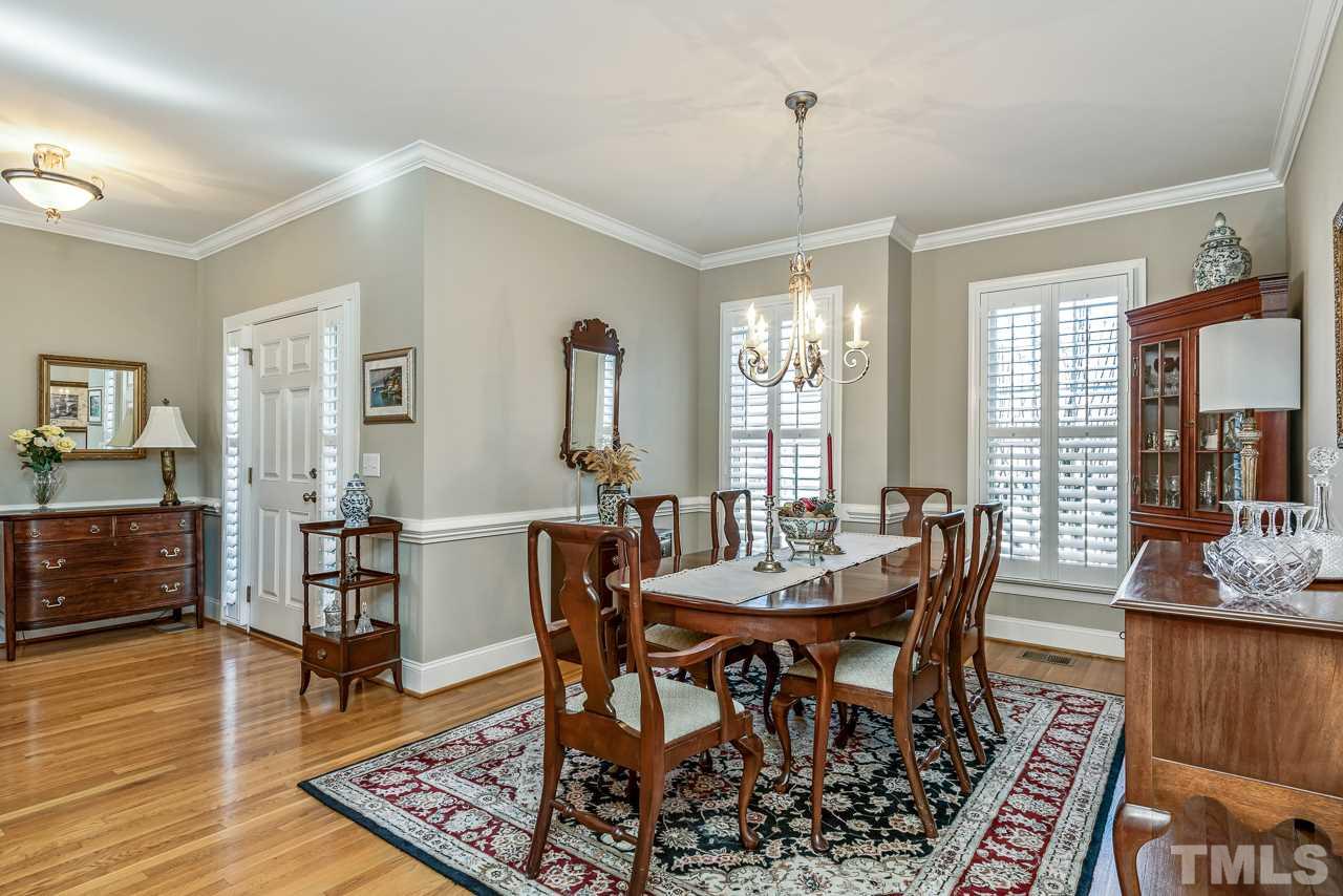 7913 Pine Timber Drive Raleigh, NC 27613 - Photo 7 of 25 a view of a dining room with furniture window and wooden floor