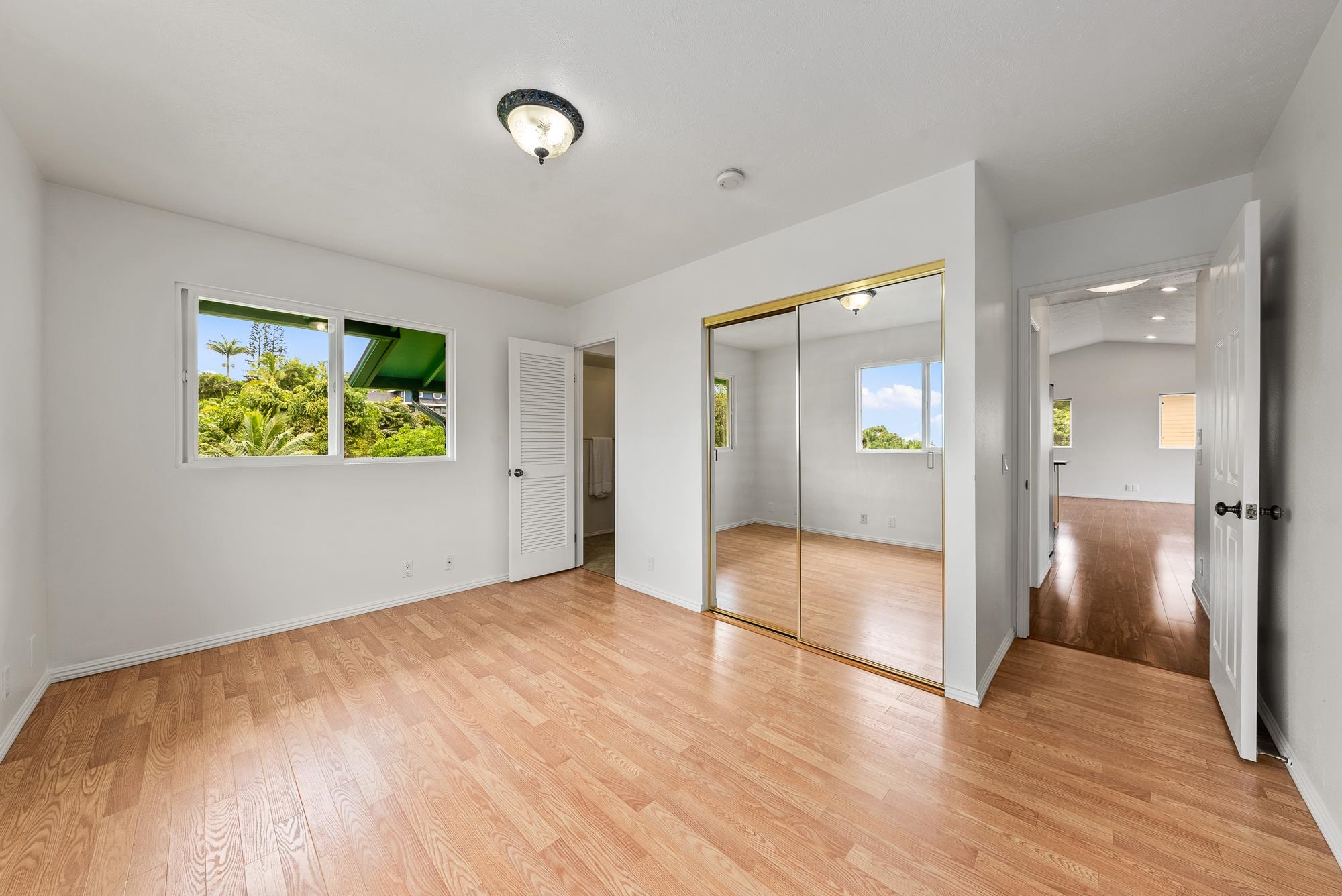 4535 Opana Place Haiku, HI 96708 - Photo 11 of 43 wooden floor in an empty room with a window