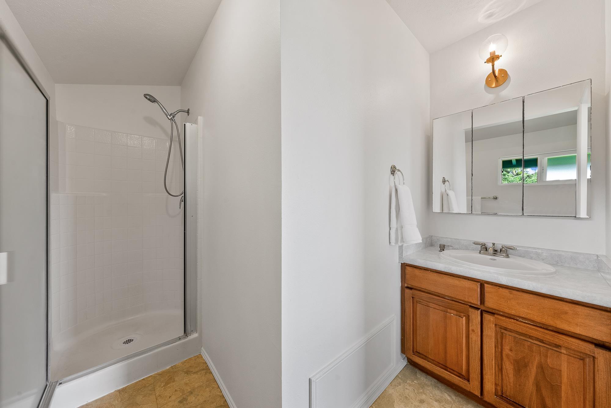 4535 Opana Place Haiku, HI 96708 - Photo 13 of 43 a bathroom with a granite countertop sink and a mirror