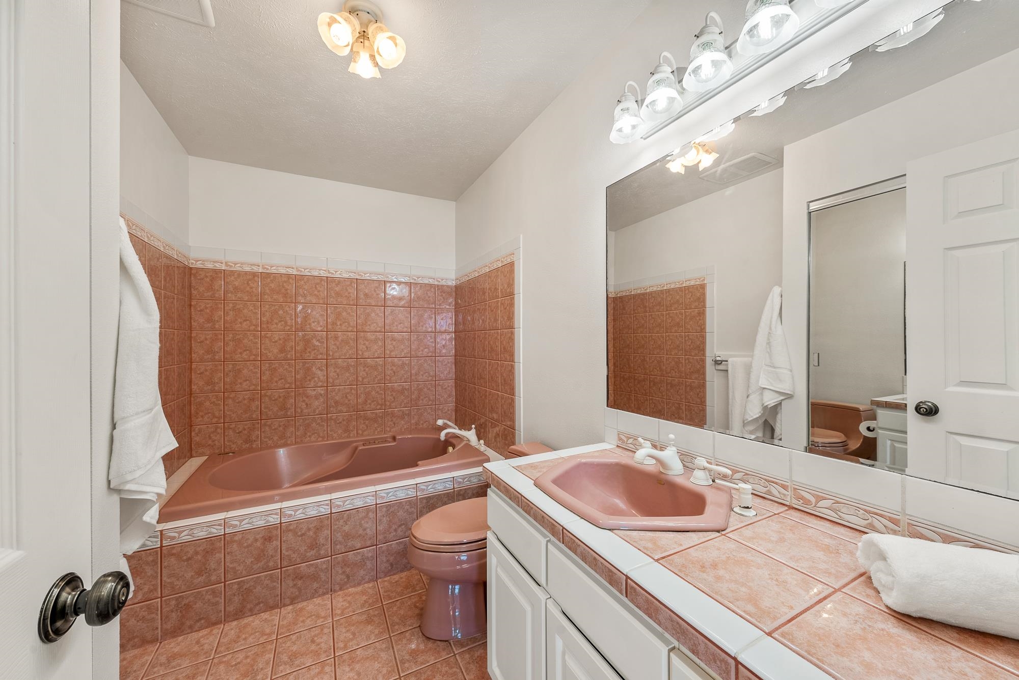 4535 Opana Place Haiku, HI 96708 - Photo 14 of 43 a bathroom with a granite countertop sink a toilet and bathtub