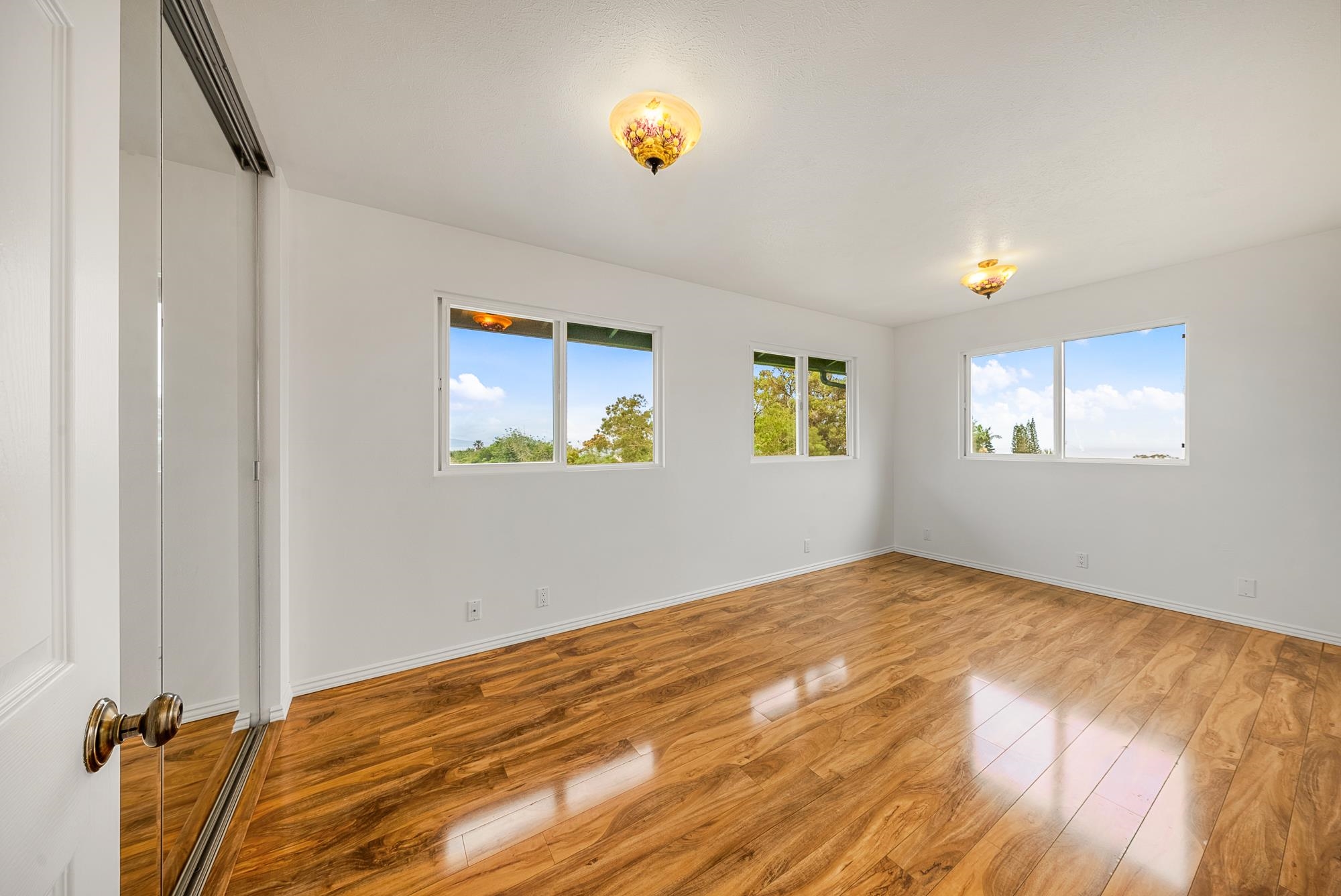4535 Opana Place Haiku, HI 96708 - Photo 17 of 43 a view of a room with a window and a ceiling fan