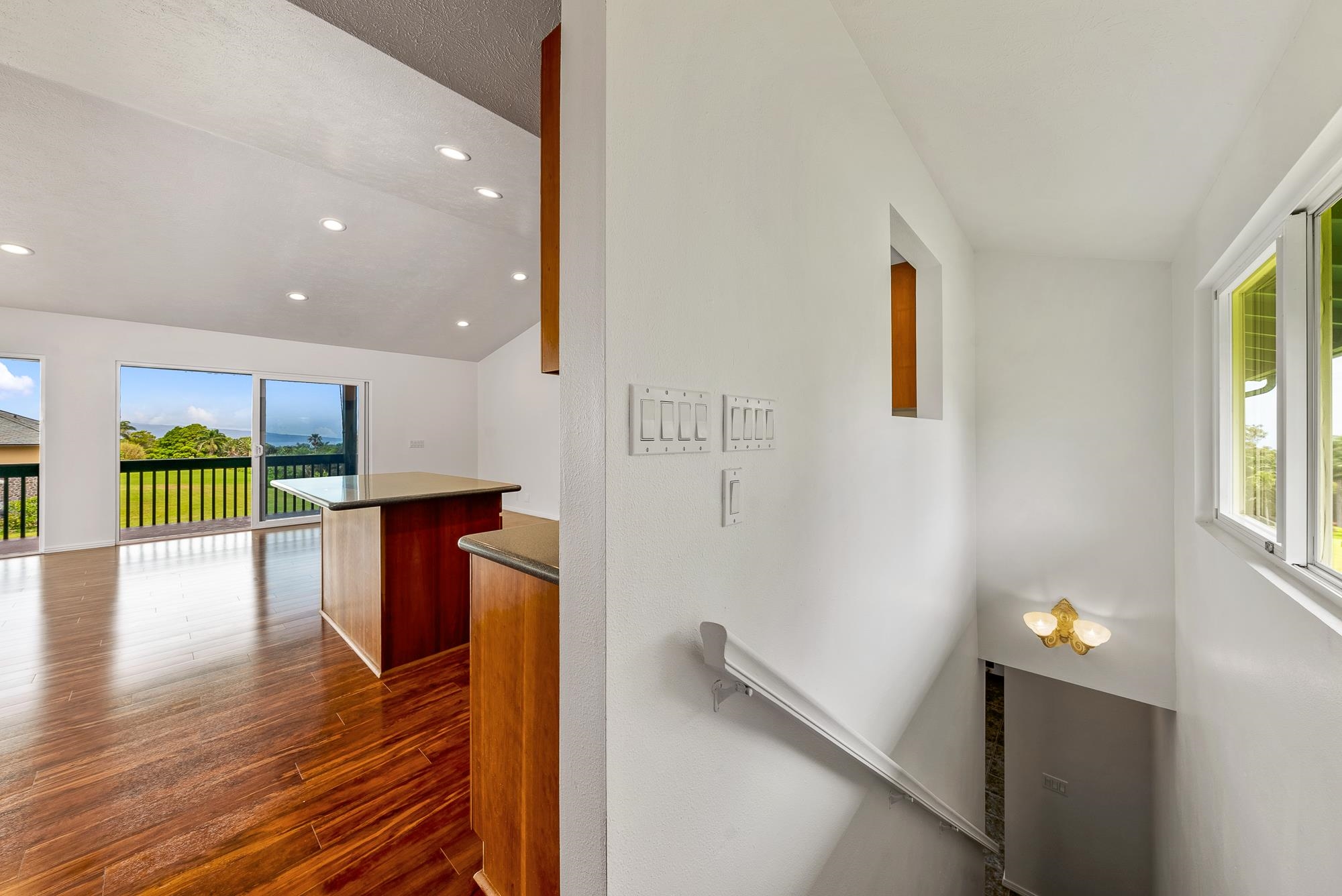 4535 Opana Place Haiku, HI 96708 - Photo 18 of 43 a view of an empty room with wooden floor and a window