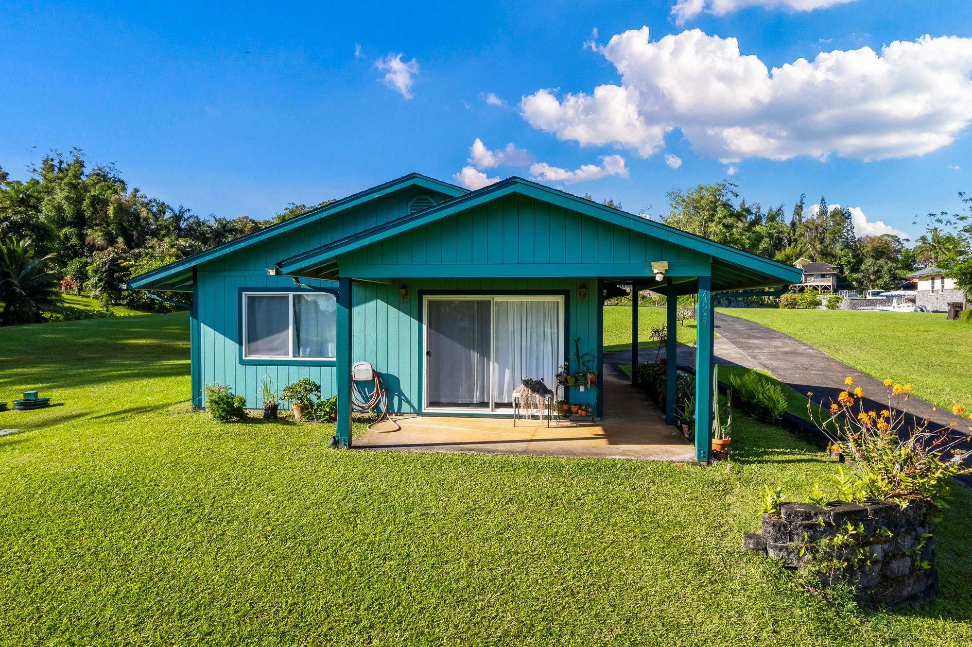 4535 Opana Place Haiku, HI 96708 - Photo 27 of 43 a view of a house with a yard patio and fire pit