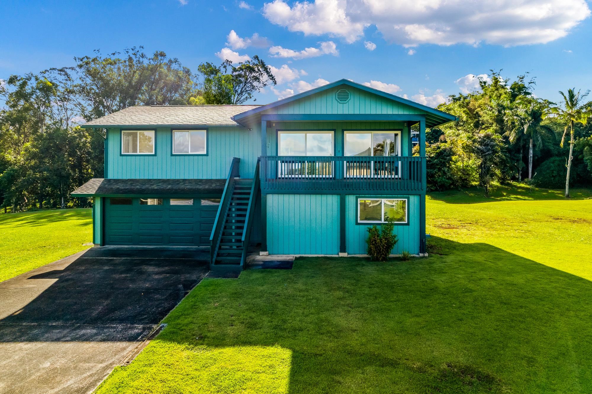 4535 Opana Place Haiku, HI 96708 - Photo 3 of 43 a view of a house with a swimming pool with a yard