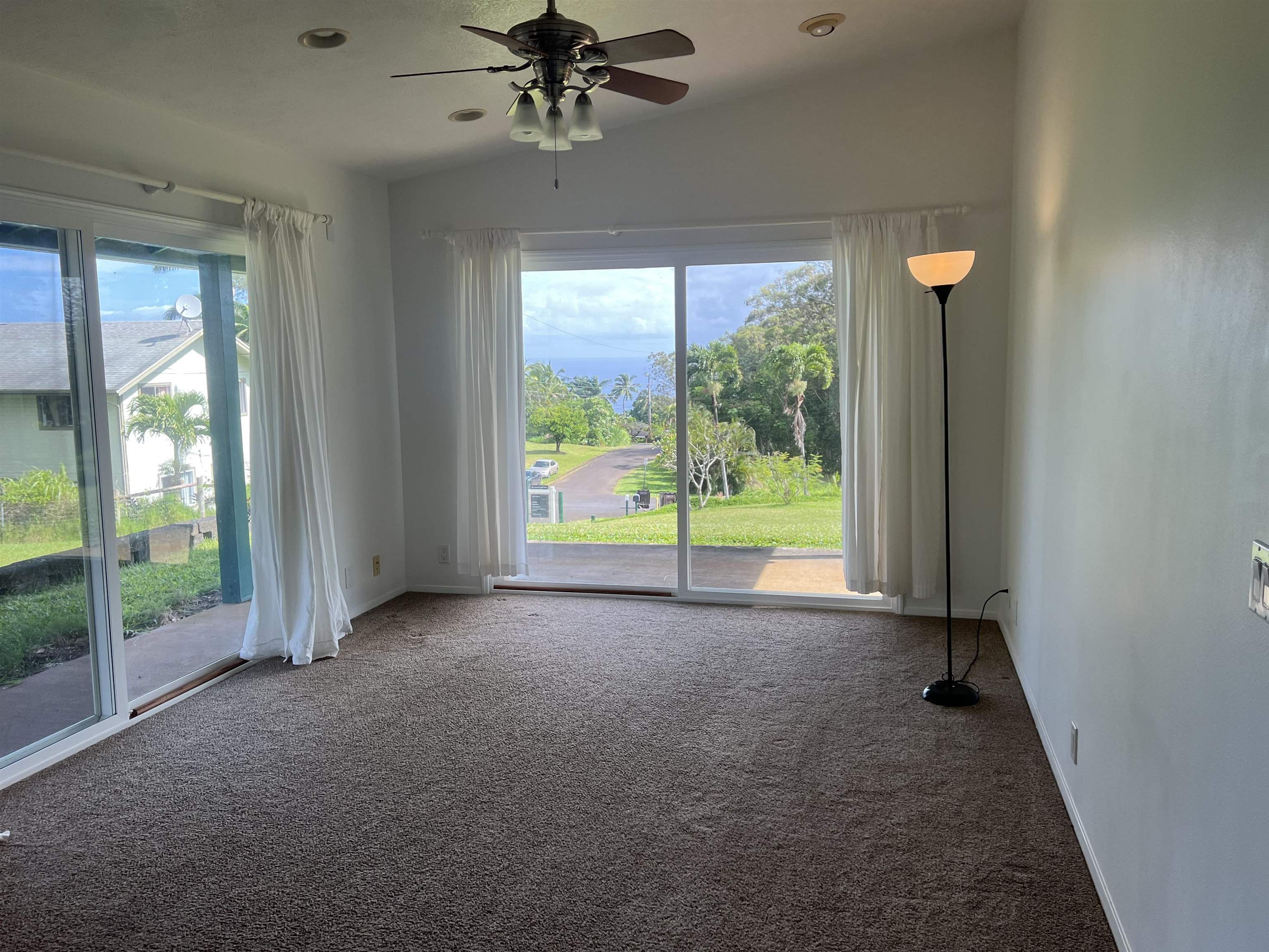 4535 Opana Place Haiku, HI 96708 - Photo 31 of 43 a view of a livingroom with a ceiling fan and window