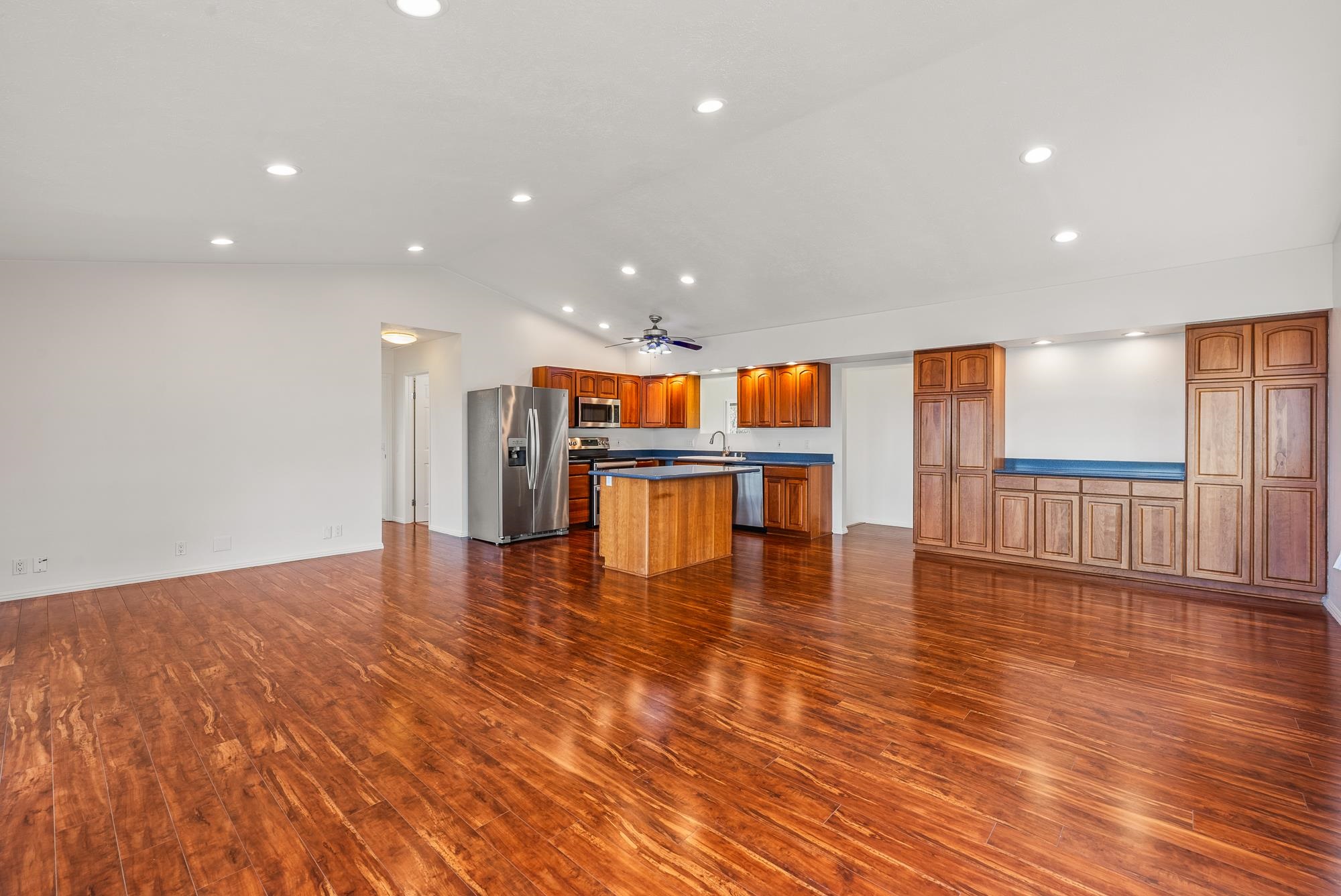 4535 Opana Place Haiku, HI 96708 - Photo 6 of 43 a view of an empty room with wooden floor and a window