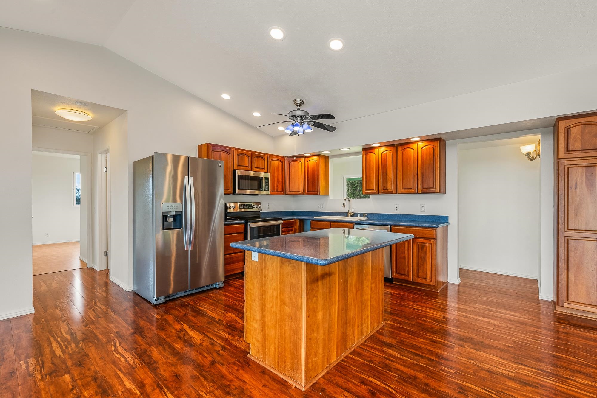 4535 Opana Place Haiku, HI 96708 - Photo 7 of 43 a kitchen with stainless steel appliances granite countertop a refrigerator a sink and a stove