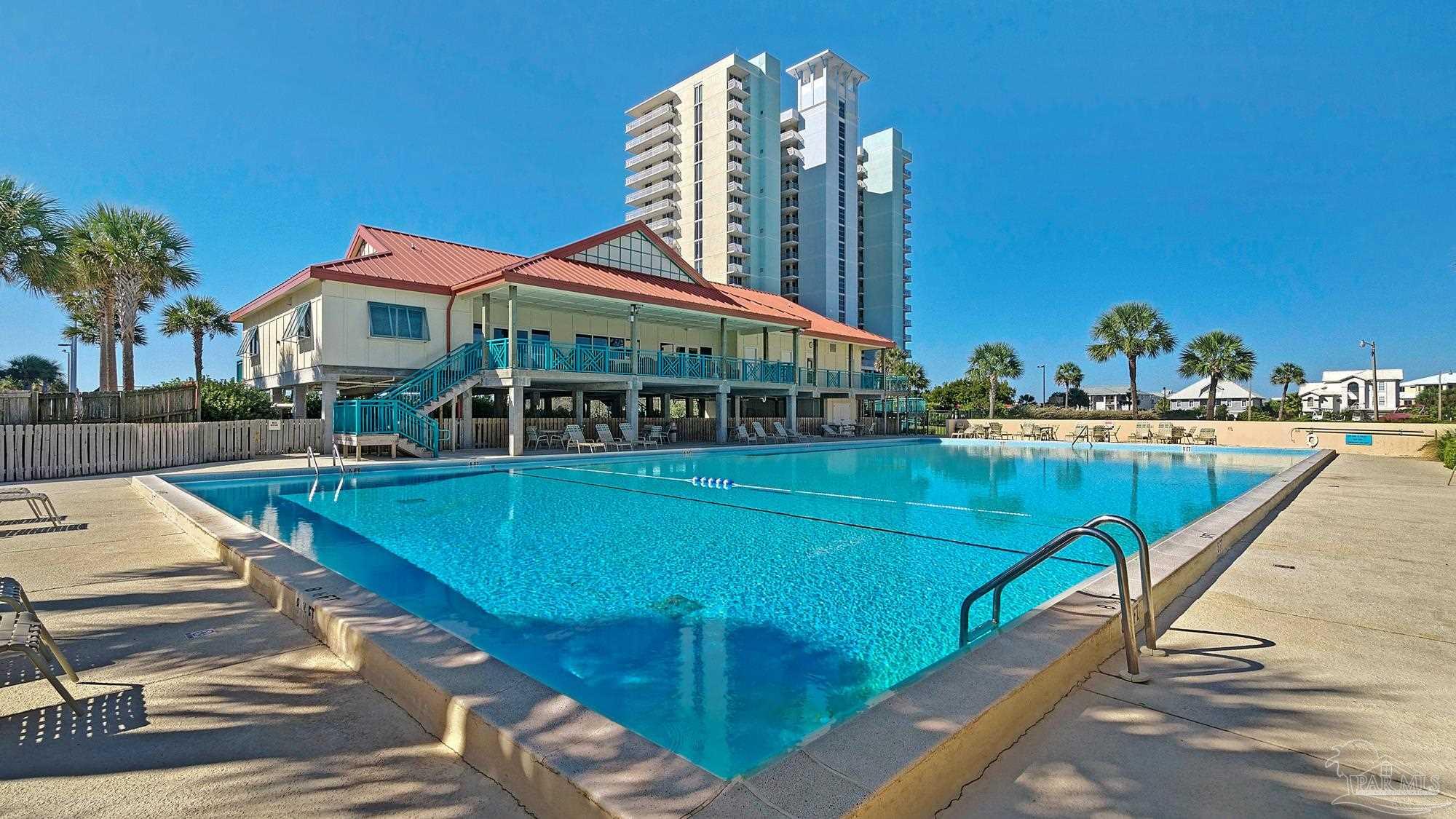 900 Fort Pickens Road, Unit 1053 Pensacola Beach, FL 32561 - Photo 36 of 57 a view of swimming pool with outdoor seating and yard