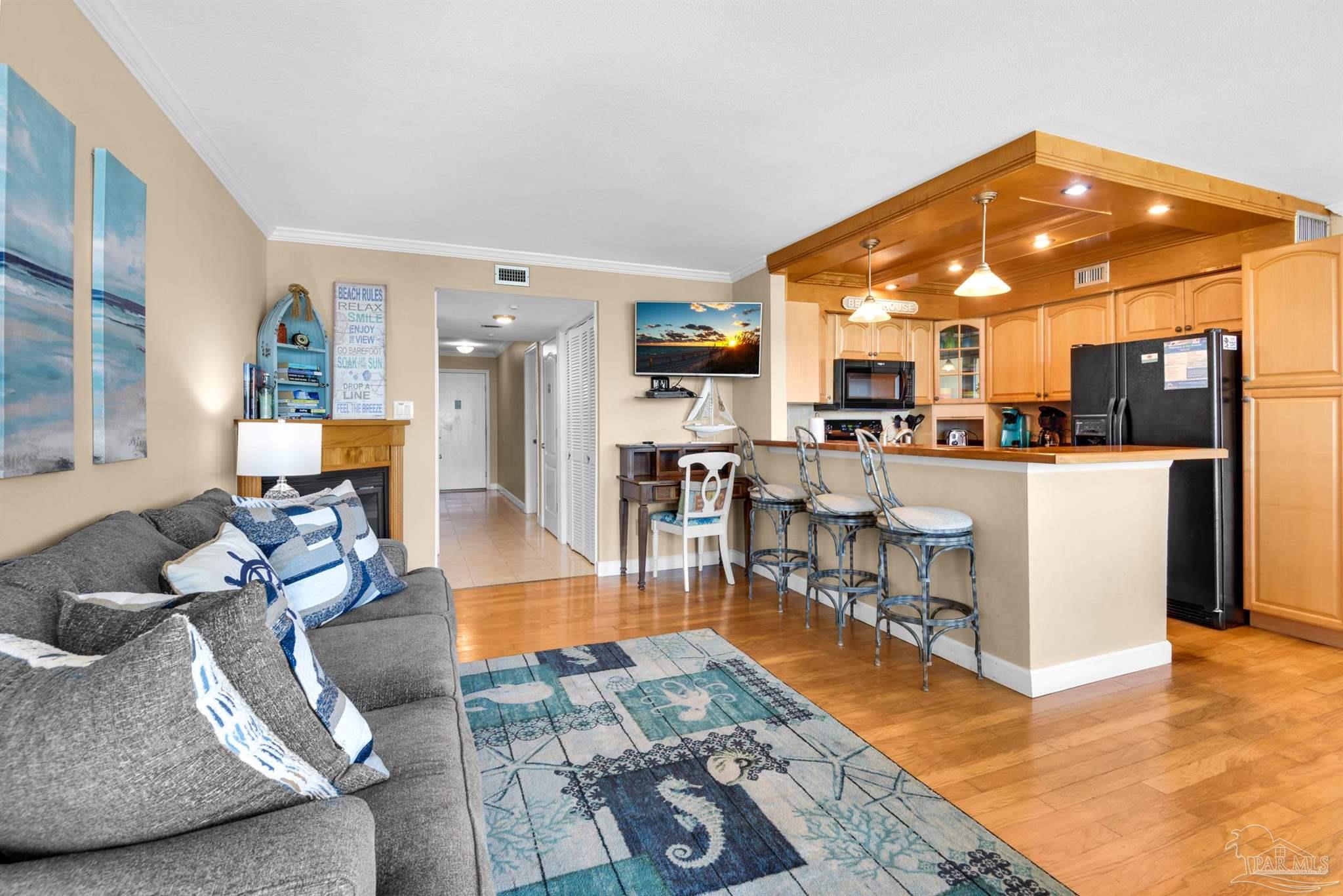 900 Fort Pickens Road, Unit 1053 Pensacola Beach, FL 32561 - Photo 6 of 57 a living room with furniture and kitchen view