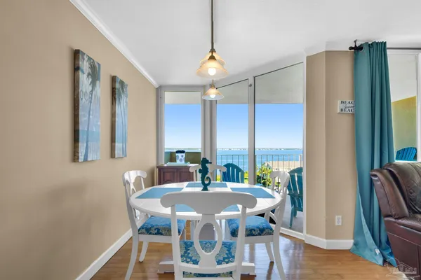 a view of a dining room with furniture window and wooden floor