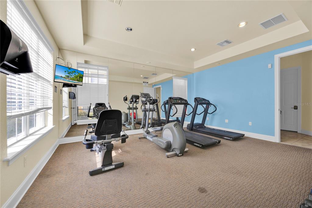 804 Terrace Ridge Circle, Unit 804 Davenport, FL 33896 - Photo 15 of 18 a view of a room with gym equipment