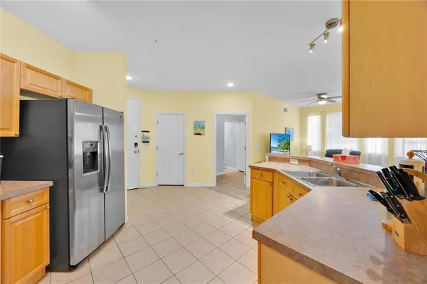 a kitchen with a refrigerator a sink and a refrigerator