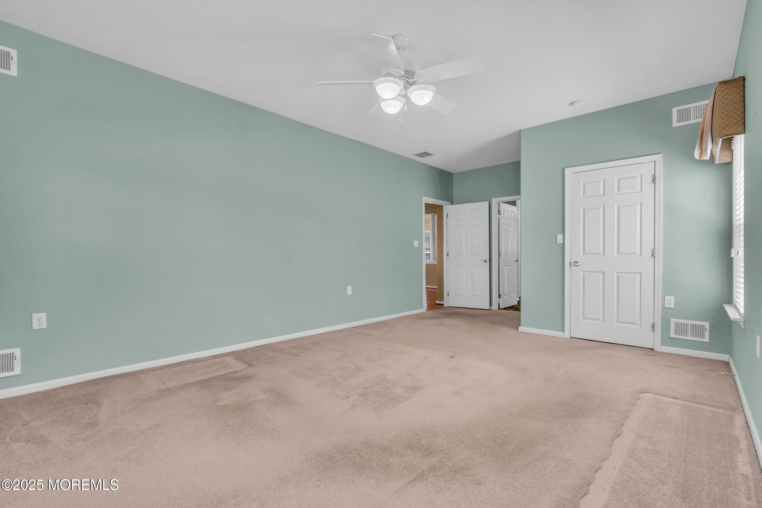 19 Lorenzo Road Manchester Township, NJ 08759 - Photo 36 of 70 an empty room with a ceiling fan and closet area