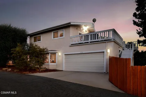 a front view of a house with a garage