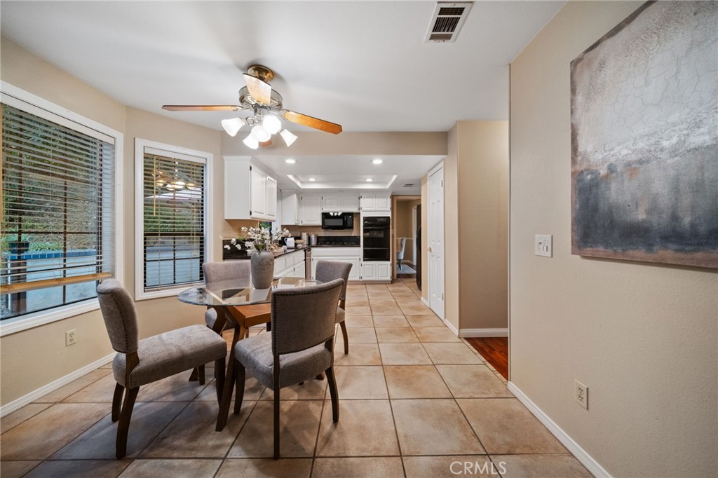 40440 Calle Torcida Temecula, CA 92591 - Photo 17 of 48 a view of a dining room with furniture and a chandelier