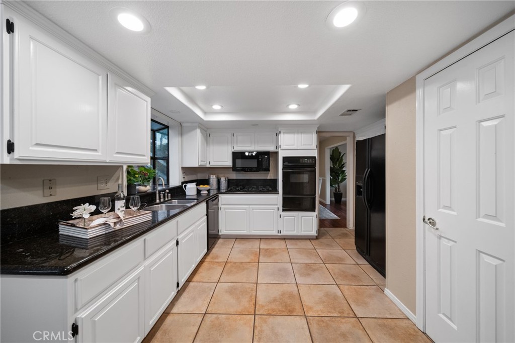 40440 Calle Torcida Temecula, CA 92591 - Photo 19 of 48 a large white kitchen with lots of counter top space