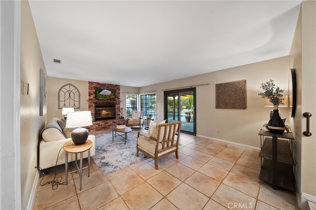40440 Calle Torcida Temecula, CA 92591 - Photo 20 of 48 a living room with furniture and a flat screen tv