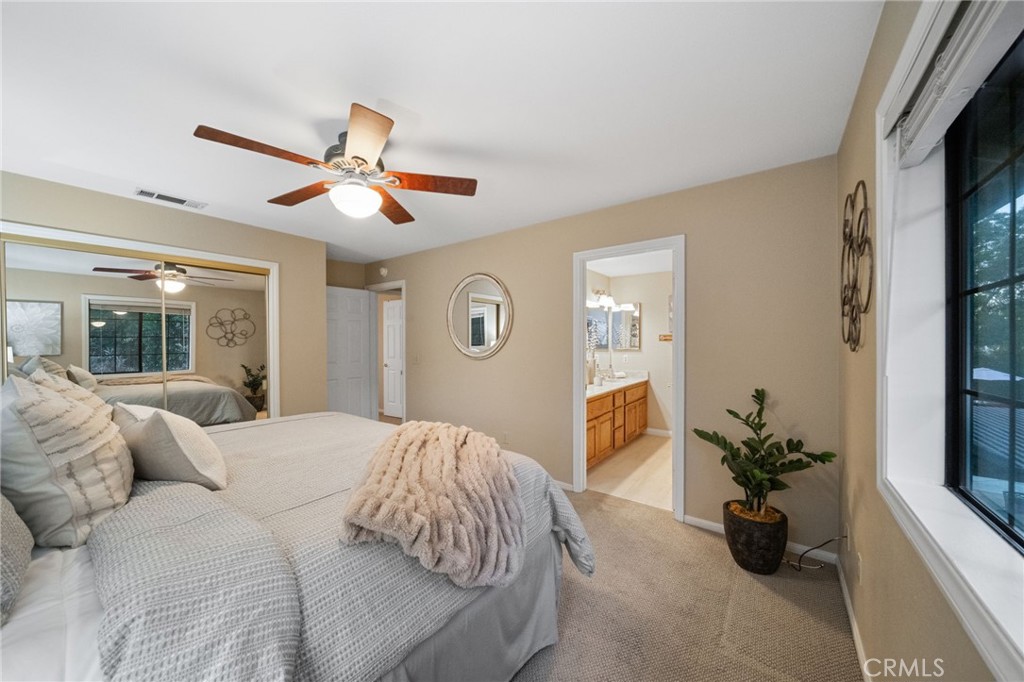 40440 Calle Torcida Temecula, CA 92591 - Photo 28 of 48 a bedroom with a bed and a chandelier