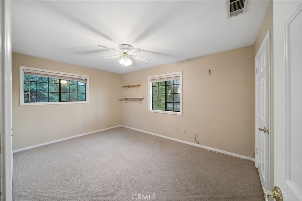 40440 Calle Torcida Temecula, CA 92591 - Photo 31 of 48 an empty room with a window and a fan
