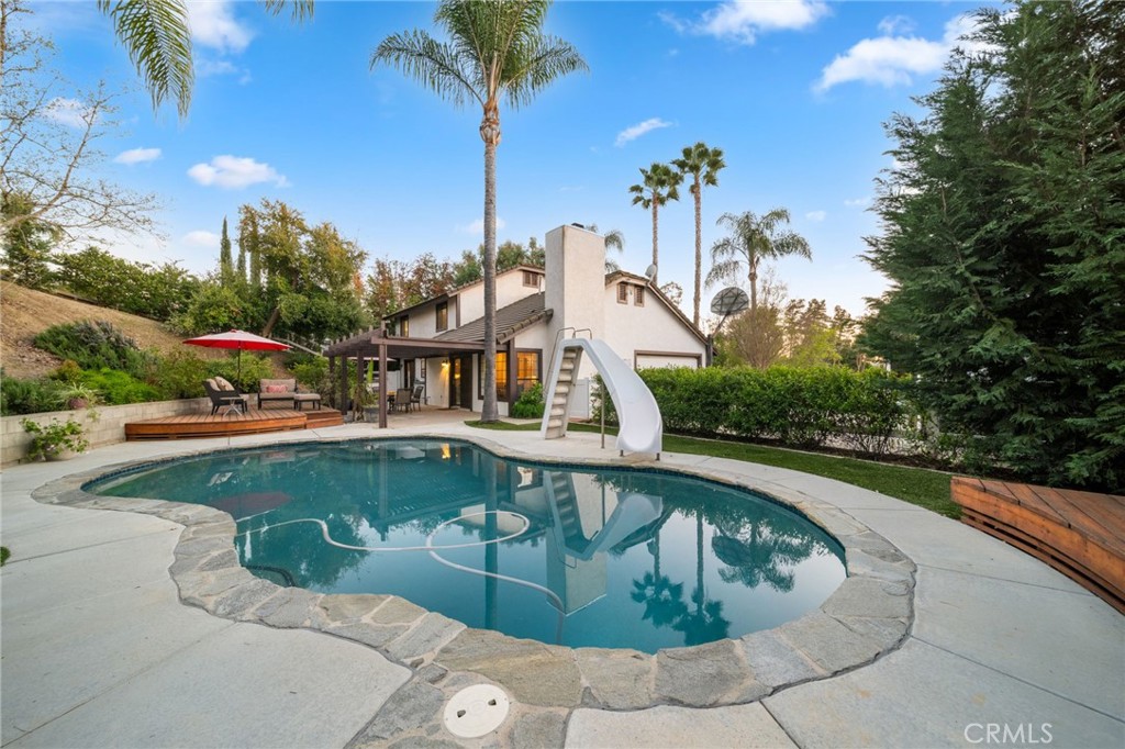 40440 Calle Torcida Temecula, CA 92591 - Photo 35 of 48 a view of swimming pool with a table and chairs