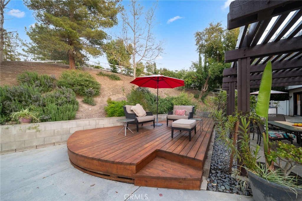 40440 Calle Torcida Temecula, CA 92591 - Photo 38 of 48 an outdoor sitting area with furniture and wooden floor