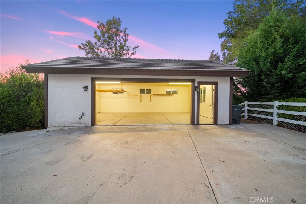 40440 Calle Torcida Temecula, CA 92591 - Photo 47 of 48 a view of an empty room with a fireplace and potted plants