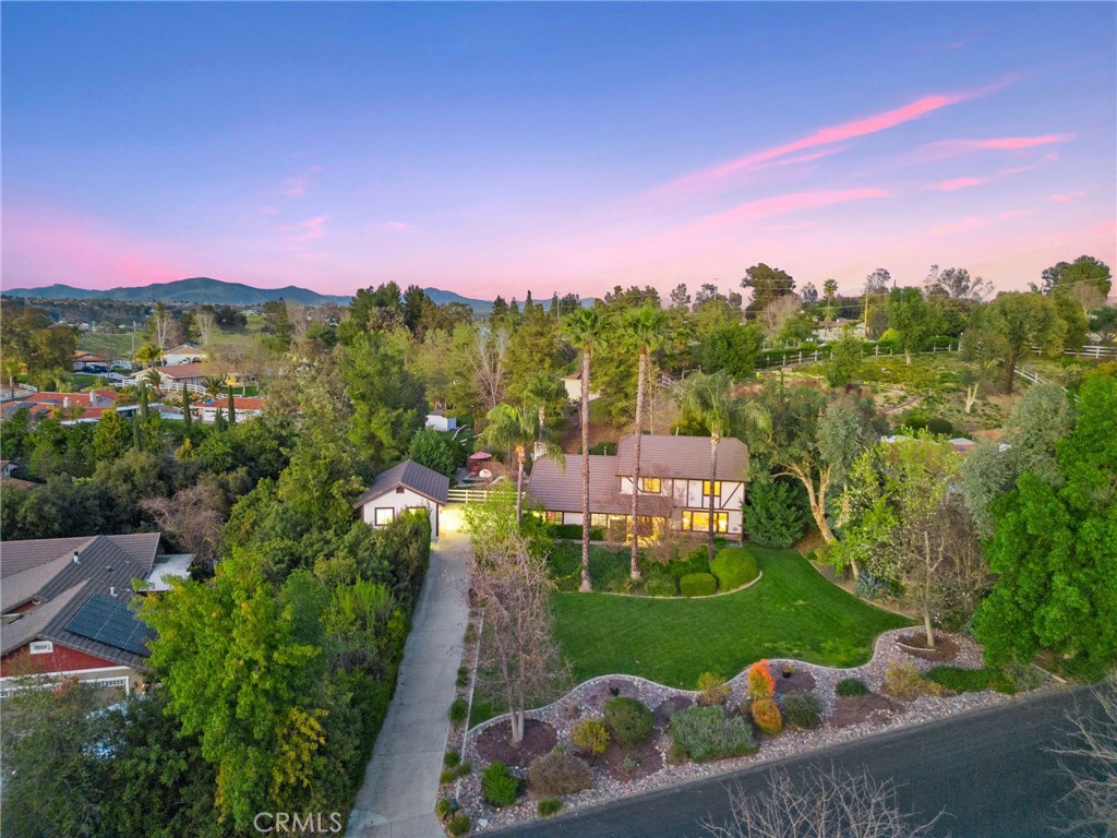 40440 Calle Torcida Temecula, CA 92591 - Photo 8 of 48 a view of a garden with a building in the background