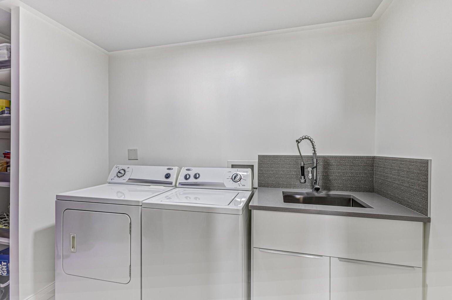 5280 North Ocean Drive, Unit 12F Singer Island, FL 33404 - Photo 33 of 66 a utility room with dryer and washer