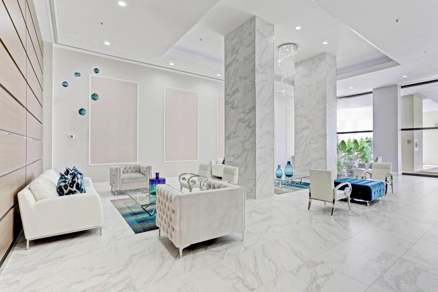 5280 North Ocean Drive, Unit 12F Singer Island, FL 33404 - Photo 36 of 66 a living room with furniture and a large window