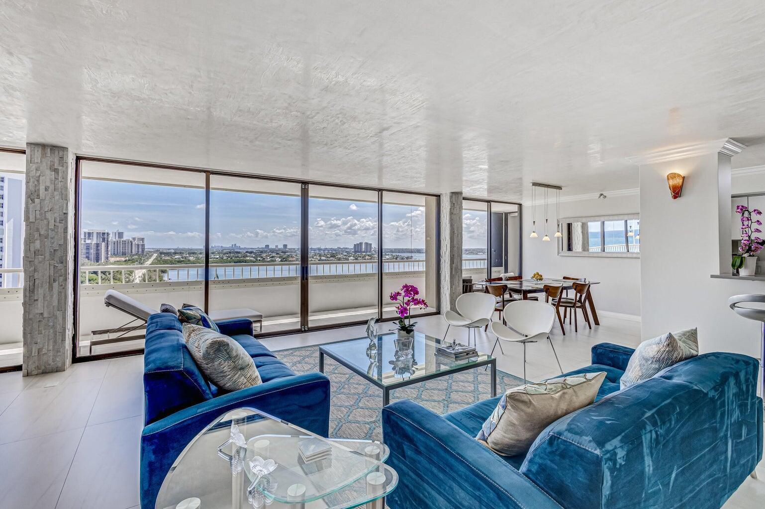 5280 North Ocean Drive, Unit 12F Singer Island, FL 33404 - Photo 9 of 66 a living room with furniture and a large window with balcony view