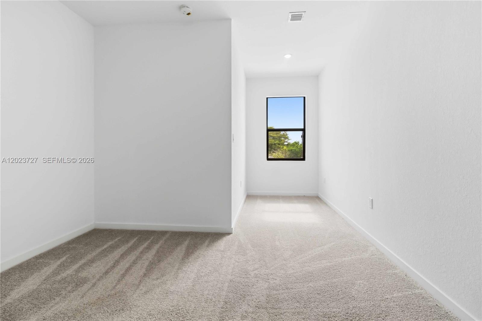 22348 Southwest 115th Court, Unit 22348 Miami, FL 33170 - Photo 14 of 37 an empty room with a window