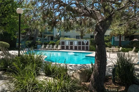 a view of a house with a yard balcony and sitting area